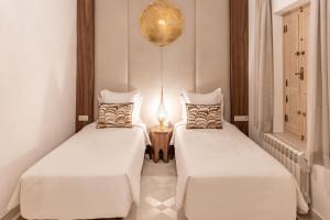 Postel nebo postele na pokoji v ubytování Riad Nyla Wellness and Spa