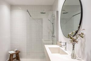 a bathroom with a sink and a shower with a mirror at Las Rocas Beach-Ciutat Jardi Playa in Palma de Mallorca +15 photos