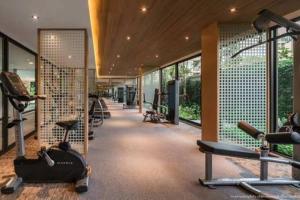 a gym with cardio equipment in a building at Cozy Room in Bangkok, BTS Onnut (E9) Station in Bangkok