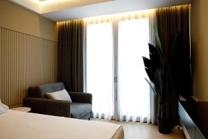 Postel nebo postele na pokoji v ubytování Caramel Boutique Hotel