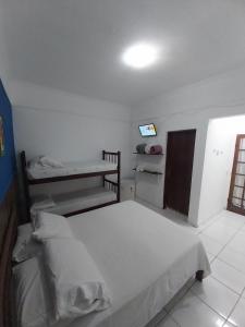 Postel nebo postele na pokoji v ubytování Pousada Brilho De Paraty