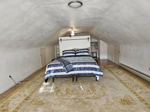 a bedroom with a bed in an attic at Indian Lake House in Worcester