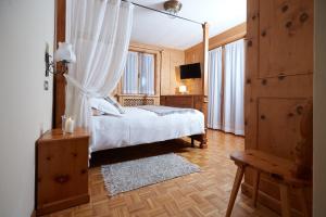 En eller flere senge i et værelse på Meublè Cima Bianca Garni