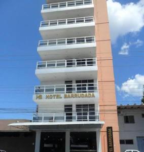 a tall white building with a sign on it at Barrudada Palace Hotel-Boa Vista in Boa Vista