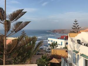 a view of the ocean from a building at villa soleil in Mirleft