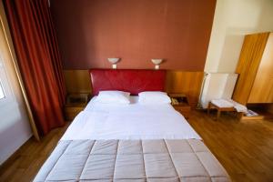 Postel nebo postele na pokoji v ubytování Giannis Hotel