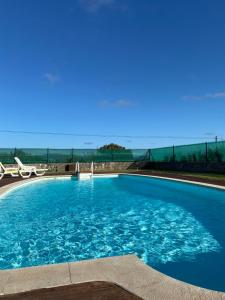 A piscina em ou perto de Casal Serrano Charme e Tranquilidade