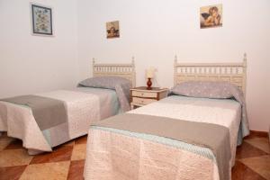 Postel nebo postele na pokoji v ubytování Claustro de las Clarisas