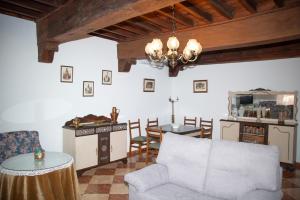 a living room with a couch and a table at Claustro de las Clarisas in Villanueva de los Infantes