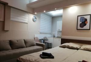 Voodi või voodid majutusasutuse Blue Carpet Rooms toas