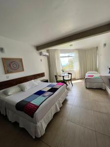 Postel nebo postele na pokoji v ubytování Hotel Fazenda Triunfo