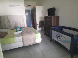 Un pat sau paturi într-o cameră la Bluehibiscus