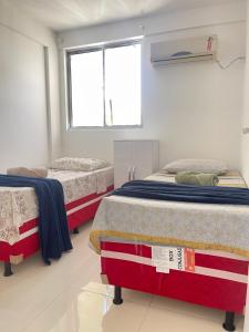 Postel nebo postele na pokoji v ubytování Apto Garagem Wifi Condomínio Piscina Ar-condicionado 2 Quartos