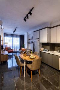 a kitchen and dining room with a table and chairs at Deluxe Marine House in Marmaris