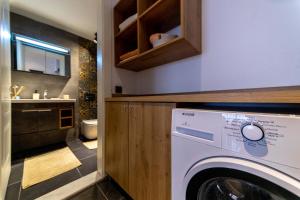 a washer and dryer in a bathroom with a sink at Deluxe Marine House in Marmaris