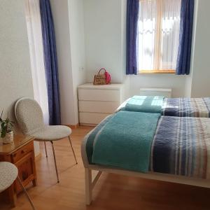 En eller flere senger på et rom på Josy's Home Zermatt