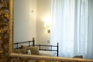 A bed or beds in a room at Affittacamere Arosio