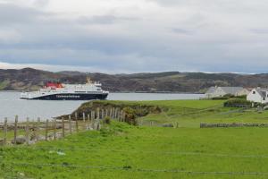 a large ship in a body of water at Stoneyfield South Cottage in Stornoway
