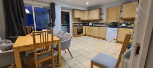 a kitchen and dining room with a table and chairs at Private shared room near Blanchardstown shopping center 