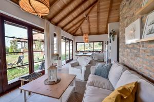 a living room with a brick wall at Top - kuća za odmor in Bukovik