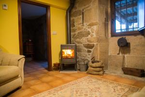 A seating area at A CASA DA MOREIRA - Casa rural en Ponte Maceira