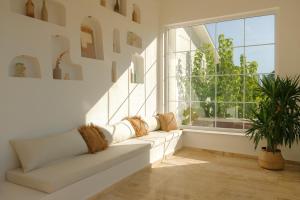 A seating area at RAW BEACH HOTEL