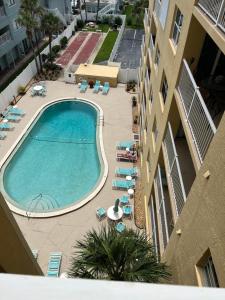 an overhead view of a swimming pool in a building at Ponce de Leon Towers in New Smyrna Beach