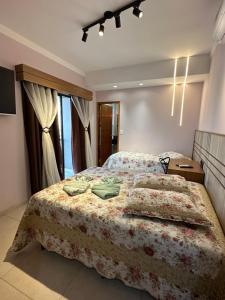 Un pat sau paturi într-o cameră la Pousada das Águas