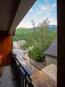 a balcony with a view of a street at L'appart de Lary in Saint-Lary-Soulan