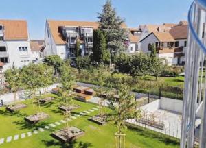 an aerial view of a park with trees and buildings at Casa Bella Metzingen in Metzingen