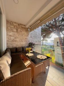 a living room with a couch and a table at Dune Apartments, San Pietro Resort in Lalëz