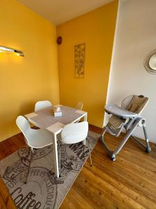 a dining room with a table and a treadmill at Apartmán u Dómu in Olomouc