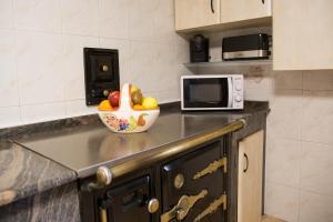A kitchen or kitchenette at A CASA DA MOREIRA - Casa rural en Ponte Maceira