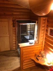a room with a large window in a wooden cabin at Chalet Cervus in Font-Romeu-Odeillo-Via