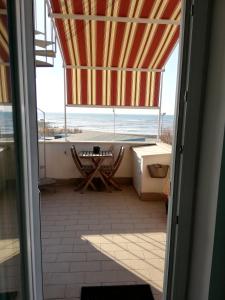 a view of a bathroom with a view of the ocean at B&B Antico Porto Tarquinia in Tarquinia
