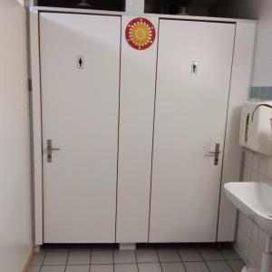 two white lockers in a bathroom with a sink at THE BEST LAKE HOUSE -3 minutes to the train in Spiez