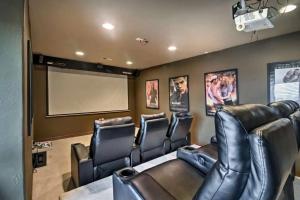 a movie room with leather chairs and a projection screen at The Brighton Exchange in Brighton