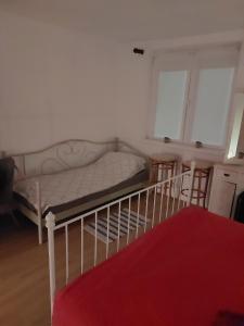 Postel nebo postele na pokoji v ubytování Ladanjska kuća Magistra Erdut