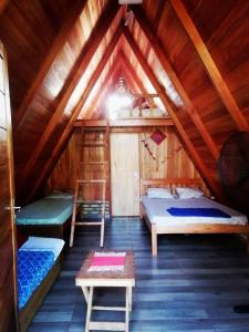 Postel nebo postele na pokoji v ubytování Cabaña del lago