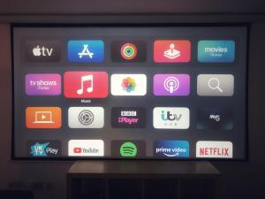 a television screen with a bunch of different apps at Apartment in old street in London