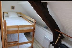 a room with two bunk beds in a attic at Maison pêcheur Quimiac (Mesquer) in Mesquer