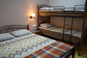 Postel nebo postele na pokoji v ubytování Velio Guest House