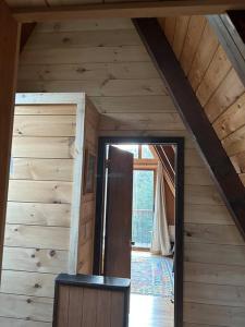 an attic room with an open door in a house at Mount Snow A Frame with Jacuzzi in Dover