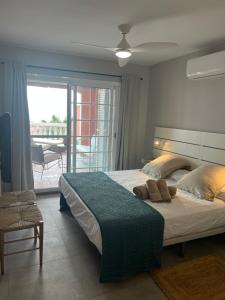 a bedroom with a large bed and a balcony at Playa del Duque-Amazing views 2 bedroom in Adeje +94 photos