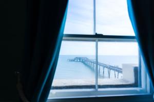 a view of a pier from a window at The Clarendon Hotel in Deal