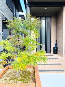 Jardin de l'établissement JOY IN民宿两站关西机场一站奥莱，整租，提供机场接送服务,步行可达便利店、免税购物中心、药妆店