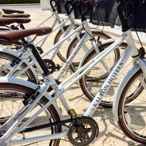 a row of white bikes parked next to each other at Kalyon Cesme in Çeşme