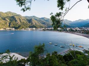 a view of a beach with boats in the water at Elite World Marmaris - Adult Only in Marmaris
