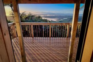 a view from the balcony of a cabin with a view at Te Tiro Accommodation in Waitomo Caves