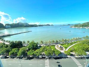 a view of a body of water with a beach at New Way Hotel in Cat Ba